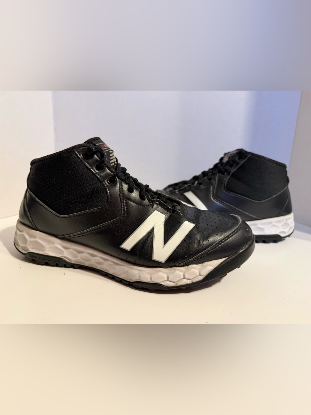 The New Balance Men's 950 V3 Turf Mid-Baseball/ Softball Shoe in Black/White